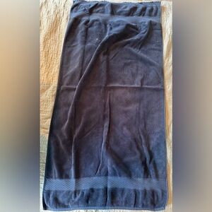 Blue Towel- used. Some rips, tears, and white bleach stain(s).